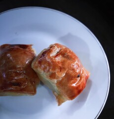 Bolen bread is a typical Indonesian bread that has a crunchy layer like a croissant, made from baked wheat flour and filled with cheese, banana or other things. Bolen bread is served on a white plate