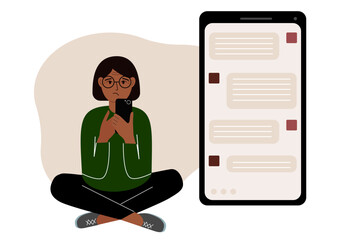 A woman sits and holds a phone. The correspondence is visible on the screen. Concept of chat, sms, service, technical support.