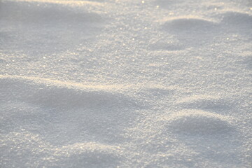 snow with shadows and visible snowflakes, white winter background