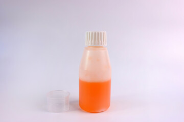 Medicinal syrup and a vessel with liquid volume divisions. Treatment and prevention of diseases. Strengthening immunity.