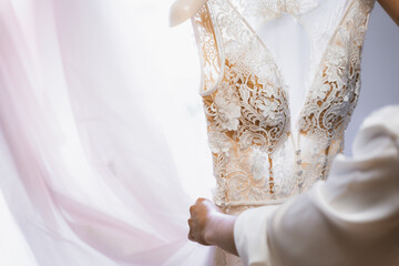 Detail of the wedding dress taken by the bride before the ceremony