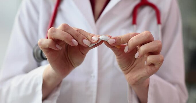 Doctor hands breaking cigarette in clinic closeup 4k movie slow motion