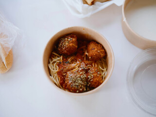 Food from delivery on the table in plastic utensils, a fast food concept