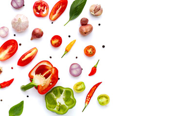 Various fresh vegetables and herbs on white background.