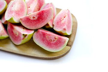 Fresh pink guava on white background.