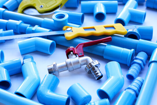 Plumber equipment with blue pvc pipe connections for plumbing work.