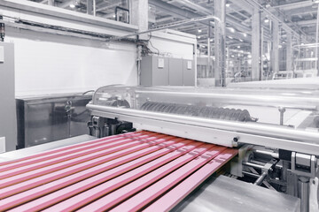 Closeup set pink souffle marshmallows sweets on conveyor automatic line factory.