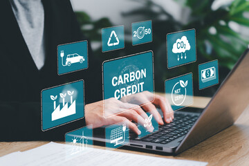 Carbon credit concept with icon on green globe reducing carbon concept, Businesswomen show icon...