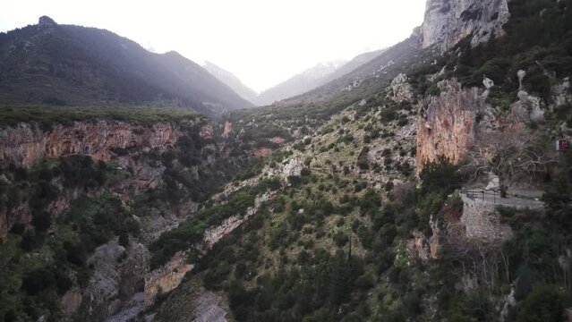 Drone footage of the scenic Valitsa gorge with mountains in the background in Phthiotis, Greece