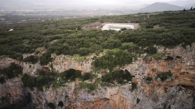 Drone scene of an artificial pond on the edge of Velitsa gorge in Amfikleia-Elateia, Greece