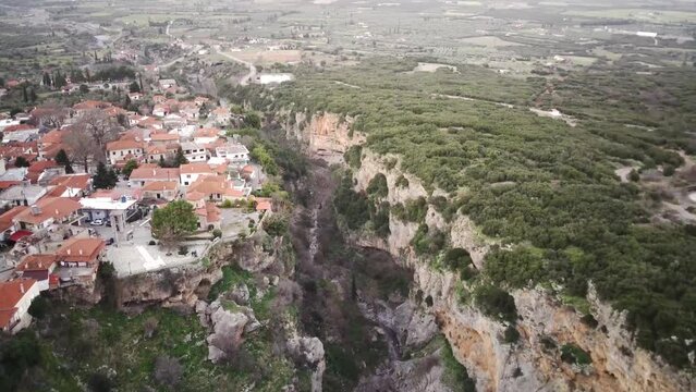 Drone footage of Tithorea municipality on the Velitsa gorge at sunset in Phthiotis, Greece