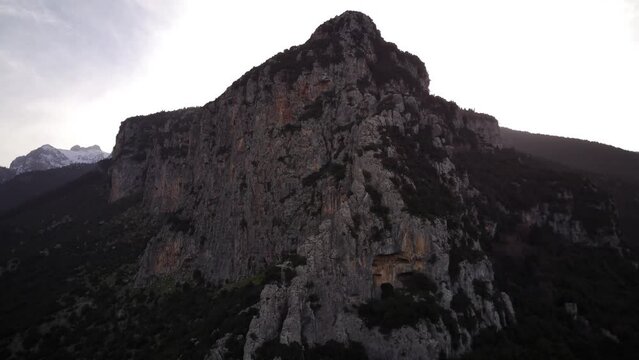 Scenic view of a rocky cliff on Velitsa gorge against cloudy sky near Tithorea municipality, Greece
