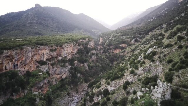 Drone shot of Valitsa gorge with mountains in the background in Amfikleia-Elateia, Phthiotis, Greece