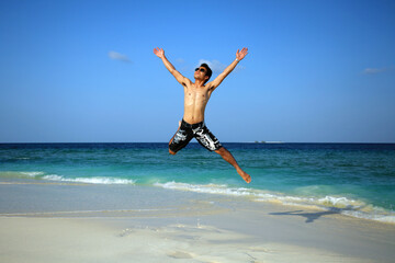 Jumping into the paradise in Maldives