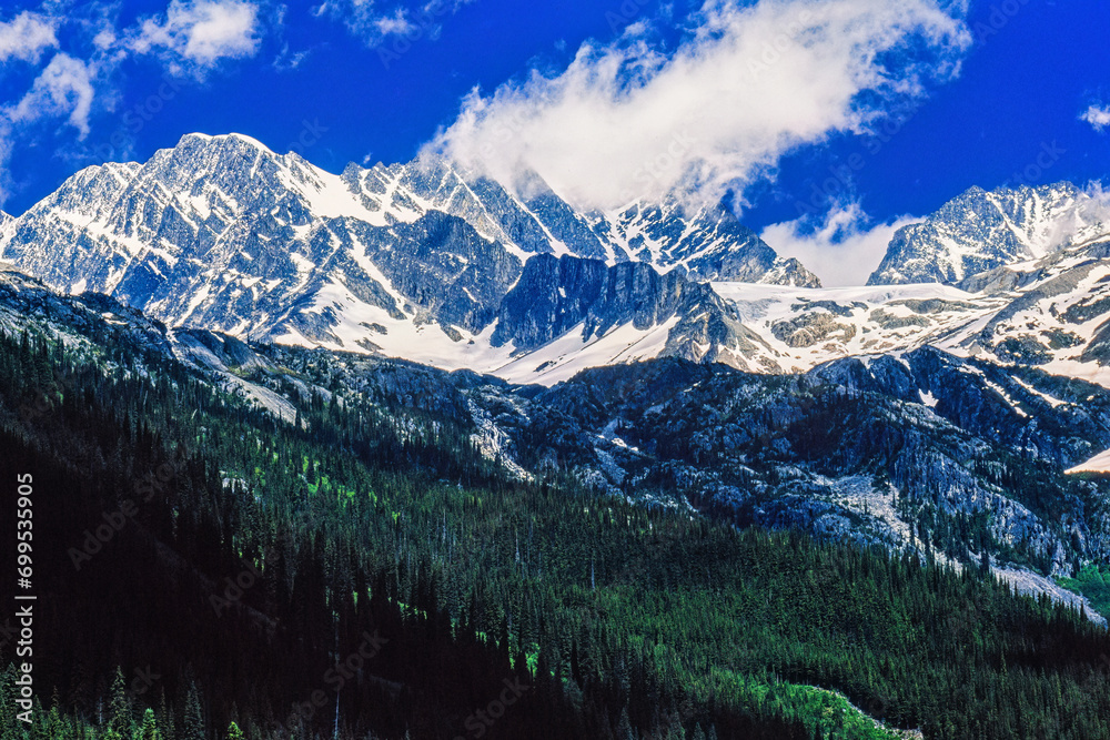 Sticker Scenic view at a mountainous landscape view with snow capped peaks