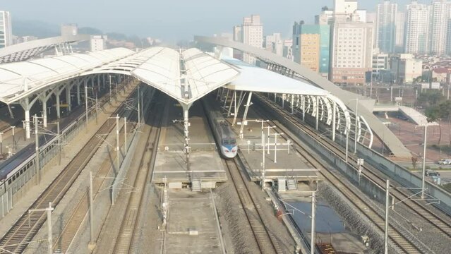 a high-speed train departing from a station,  KTX train in Korea, Osong station