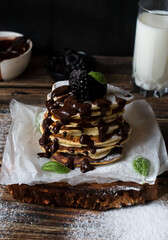 Pancakes with berries. on a wooden background. dessert. breakfast.