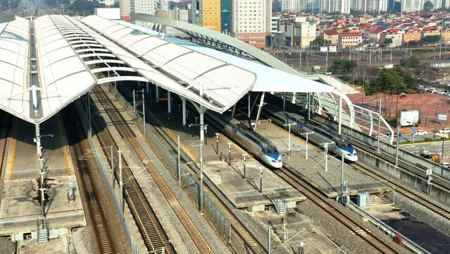 a high-speed train departing from a station,  KTX train in Korea, Osong station