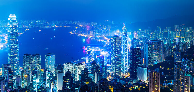Fototapeta Hong Kong cityscape with victoria harbour and large group of tall buildings at night