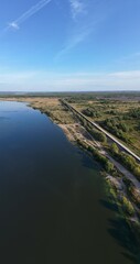Obraz premium The river bank goes beyond the horizon on the Sura River.