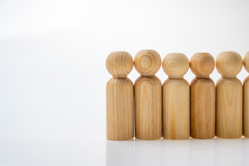 Closeup view row of wooden figure