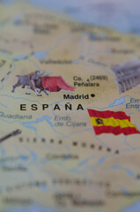 tourist map of Spain with Spanish flag next to it.