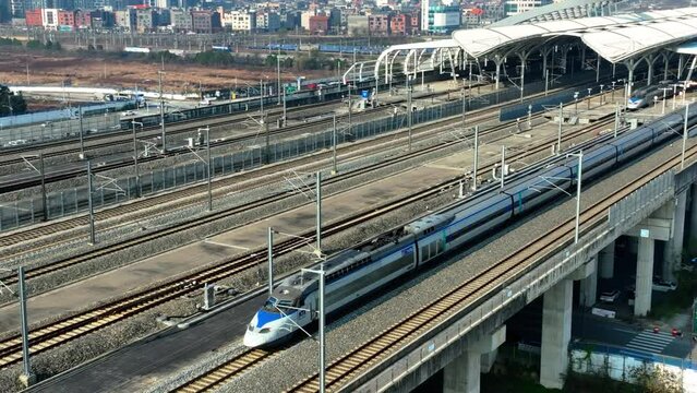 a high-speed train departing from a station,  KTX train in Korea, Osong station