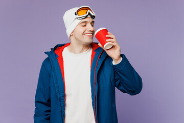 Skier man he wear warm blue windbreaker jacket ski goggles mask hat hold takeaway delivery paper...
