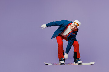Full body happy man wear blue windbreaker jacket ski goggles mask hat snowboarding touch boots...