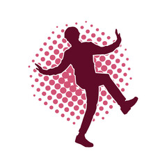 Silhouette of a male dancer in action pose. Silhouette of a slim man in dancing pose.
