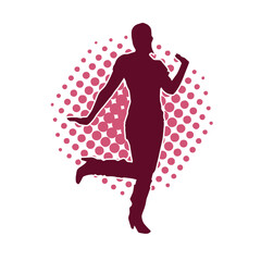 Silhouette of a female dancer in action pose. Silhouette of a slim woman in dancing pose.