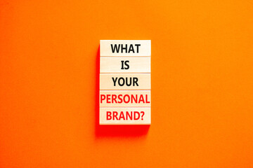 What is your personal brand symbol. Concept words What is your personal brand on wooden blocks. Beautiful orange table orange background. Business, what is your personal brand concept. Copy space.