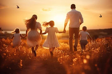 Fotobehang Happy large family: mother, father, children son and daughters running on nature on sunset © Volodymyr