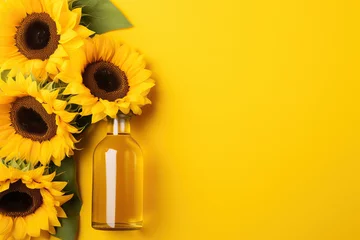 Rolgordijnen A bottle of sunflower oil and sunflower on yellow background. © Volodymyr