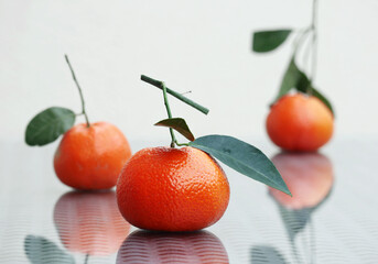 Three juicy tangerines