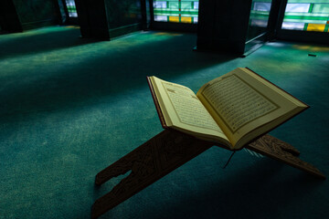 Islamic or ramadan background. The Holy Quran on the book stand