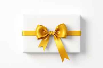 Fototapeta na wymiar White gift box tied with yellow ribbon and bow on white background top view