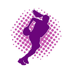 Silhouette of a female basketball player in action pose. Silhouette of a sporty woman doing basket ball sport.