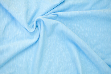 Blue light abstract fabric background with soft waves.