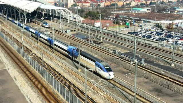 a high-speed train departing from a station,  KTX train in Korea, Osong station