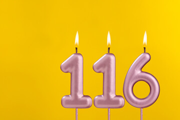 Birthday candle number 116 - Birthday celebration on yellow background