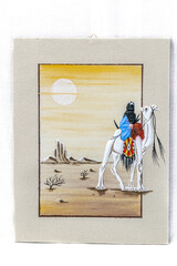 Sand painting of a Saharan rider wearing traditional black head scarf with x letter on a white camel whith clothings, sun circle in a yellow sky, plants, rocks in the sand and a mountain in background