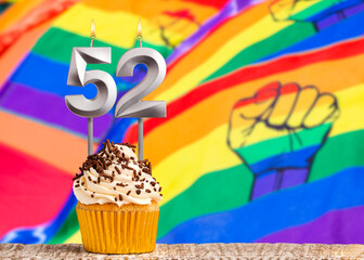 Birthday candle number 52 - Gay march flag background