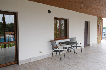 Balcony of a two-story cottage in a country complex.