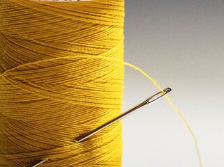 Rows of skeins of thread in various colors for sewing machines and general household use, sold in specialty stores.
