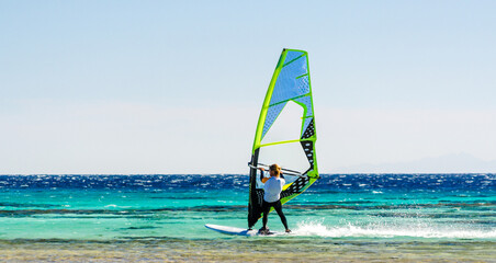 one surfer rides in the Red Sea in Egypt Dahab