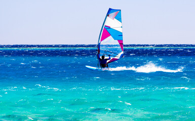 windsurfer rides on the waves of the Red Sea in Egypt Dahab South Sinai