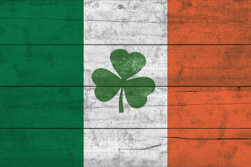 St. Patrick's Day background. Shamrocks against the background of the Irish flag. Decoration for...