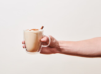 Hand holding a Chai Latte