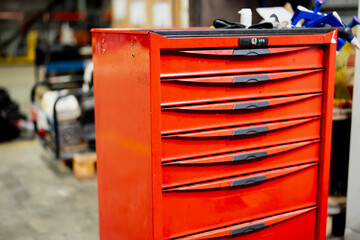 Red construction tool box in a garage